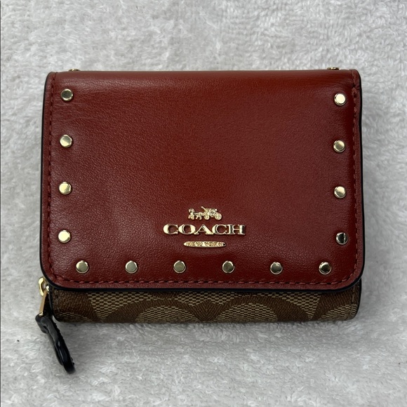 Coach Handbags - Coach Burgundy and Brown Studded Wallet
